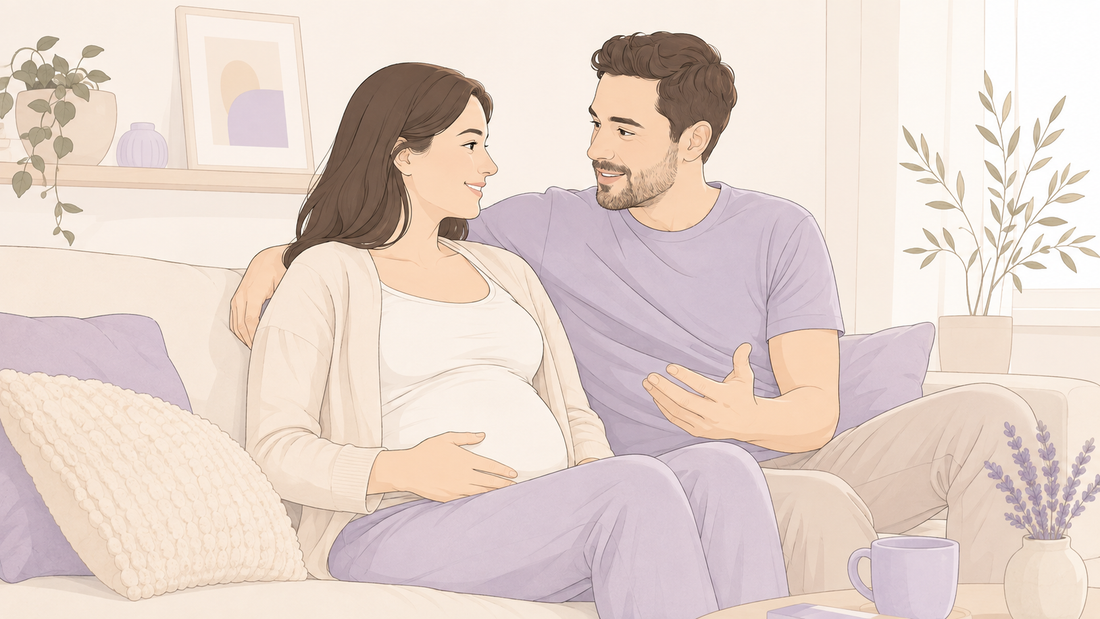 Pregnant couple sitting together at home and sharing a supportive, affectionate conversation during pregnancy